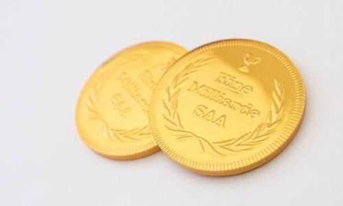 Juerg_Siegrist_Holding_AG_Schokoladenmünzen_Gold_Sujet_Eine_Milliarde_SAA