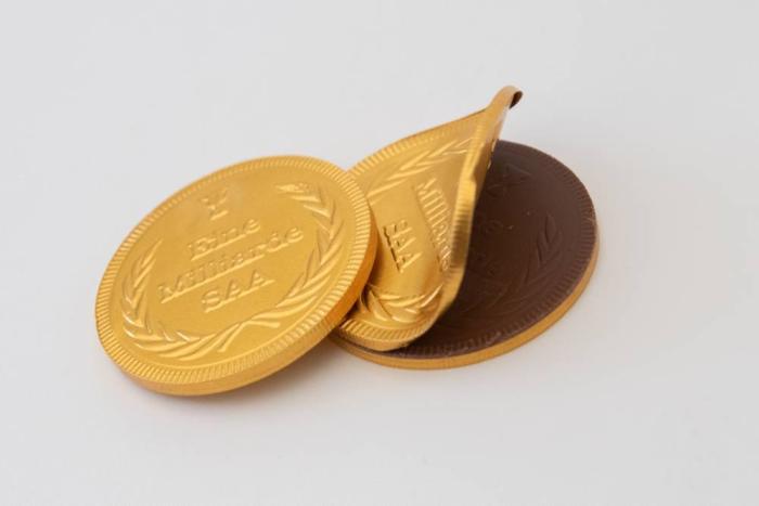 Juerg_Siegrist_Holding_AG_Schokoladenmünzen_Gold_Sujet_Eine_Milliarde_SAA