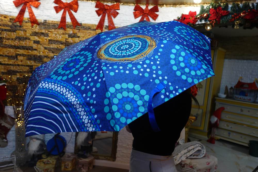 Bedruckter Taschenschirm im Aborigine-Design un mit Automatik – Juerg Siegrist AG Werbeartikel