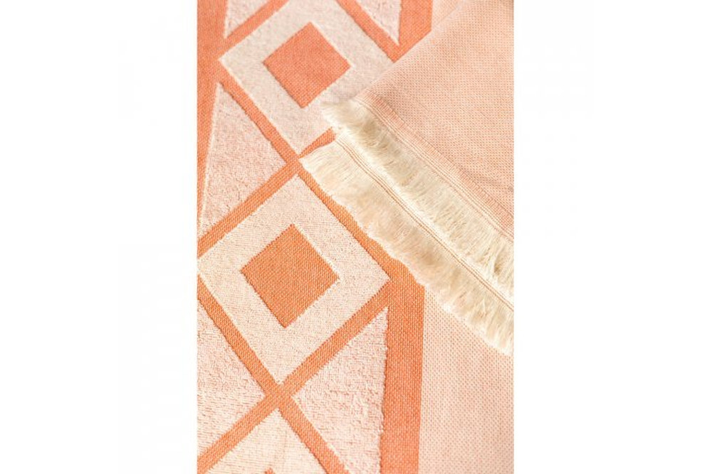 Orange-weisses Hamam Badetuch mit dekorativen Fransen und geometrischem Muster, hochwertiges Baumwolltuch mit individueller Druck- oder Stickveredelung - Detailaufnahme: